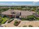 Aerial view of community clubhouse, showcasing its architecture, landscaping, and inviting entrance at 13939 Swallow Hill Dr, Lithia, FL 33547