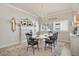Elegant dining room featuring chandelier, fireplace, and an inviting rug at 13939 Swallow Hill Dr, Lithia, FL 33547