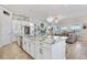 Open-concept kitchen with large island, stainless steel appliances, and seamless access to living area at 13939 Swallow Hill Dr, Lithia, FL 33547