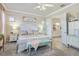 Bright main bedroom with ensuite bathroom and comfortable furnishings at 13939 Swallow Hill Dr, Lithia, FL 33547