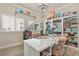Bright office with built-in bookshelves, a large window, and a stylish chandelier at 13939 Swallow Hill Dr, Lithia, FL 33547