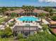 Stunning community pool featuring palm trees, lounge chairs and a covered patio for relaxation and shade at 13939 Swallow Hill Dr, Lithia, FL 33547