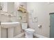 Charming powder room with pedestal sink and decorative accents at 13939 Swallow Hill Dr, Lithia, FL 33547