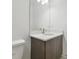 Bright bathroom with a modern vanity and sink with a large mirror at 1734 W Cherry St, Tampa, FL 33607