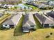 Aerial view showcasing a home with a screened-in patio at 18784 Coastal Shore Ter, Land O Lakes, FL 34638