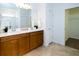 Elegant bathroom with double vanity and walk-in shower at 18784 Coastal Shore Ter, Land O Lakes, FL 34638