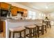 Large kitchen island with seating for four and granite countertops at 18784 Coastal Shore Ter, Land O Lakes, FL 34638