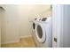 Laundry room with washer and dryer, and shelving at 18784 Coastal Shore Ter, Land O Lakes, FL 34638