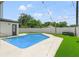 Private backyard with a refreshing pool and lush green grass at 626 E Davis Blvd, Tampa, FL 33606