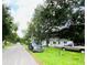 Home situated on a tree-lined street with nearby parking at 5907 8Th S Ave, Tampa, FL 33619