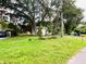 House with a large grassy front yard and mature trees at 5907 8Th S Ave, Tampa, FL 33619