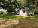 Small house with a large yard and mature trees at 5907 8Th S Ave, Tampa, FL 33619