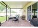 Relaxing screened patio with brick flooring and seating at 11038 Ancient Futures Dr, Tampa, FL 33647