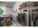 Laundry room with washer, dryer, and additional storage cabinets at 13939 Swallow Hill Dr, Lithia, FL 33547