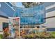 The Towers condo building entrance with mosaic art and signage at 1209 E Cumberland Ave # 807, Tampa, FL 33602