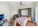 Bedroom with Murphy bed, office space, and hardwood floors at 1209 E Cumberland Ave # 807, Tampa, FL 33602
