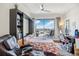 Bedroom with Murphy bed, home office and balcony access at 1209 E Cumberland Ave # 807, Tampa, FL 33602