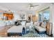 Open concept living area featuring a sectional sofa and adjacent dining area at 1209 E Cumberland Ave # 807, Tampa, FL 33602