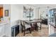 Modern dining area with a four-person table and chairs, near kitchen at 1209 E Cumberland Ave # 807, Tampa, FL 33602
