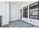 Outdoor balcony area with white siding and space to add seating at 7404 Newham Ln, Sarasota, FL 34240