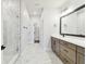 Bathroom boasting marble floors, glass shower, dual vanity, and modern finishes at 7404 Newham Ln, Sarasota, FL 34240