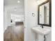 Bathroom sink area open to kitchen and common areas of the home at 7404 Newham Ln, Sarasota, FL 34240