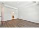 Spacious bedroom featuring hardwood floors and ensuite bathroom access at 7404 Newham Ln, Sarasota, FL 34240