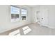 Well lit bedroom with large windows and ensuite bathroom access at 7404 Newham Ln, Sarasota, FL 34240