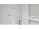 Neutral laundry room with built in shelves and utility hookups at 7404 Newham Ln, Sarasota, FL 34240