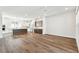 Open concept living space connecting to a kitchen with white cabinets, stainless appliances, and a center island at 7404 Newham Ln, Sarasota, FL 34240