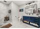 Modern bathroom with a navy blue vanity and marble floors at 1208 E Kennedy Blvd # 734, Tampa, FL 33602