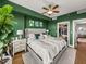 Large bedroom with green walls and walk-in closet at 1208 E Kennedy Blvd # 734, Tampa, FL 33602