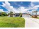 Single story home with solar panels and attached garage at 684 Corrientes Cir, Punta Gorda, FL 33983