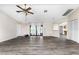 Living room with wood-look floors, vaulted ceilings and access to pool at 684 Corrientes Cir, Punta Gorda, FL 33983