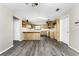 Kitchen with wood cabinets, an island, and skylight at 684 Corrientes Cir, Punta Gorda, FL 33983
