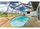 Inviting kidney-shaped pool with screened enclosure at 684 Corrientes Cir, Punta Gorda, FL 33983