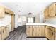 Kitchen with light wood cabinets, white countertops, and vinyl flooring at 684 Corrientes Cir, Punta Gorda, FL 33983