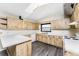 Kitchen with light wood cabinets, white countertops and vinyl flooring at 684 Corrientes Cir, Punta Gorda, FL 33983