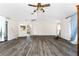 Living room with wood-look floors and access to patio at 684 Corrientes Cir, Punta Gorda, FL 33983