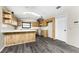 Kitchen with wood cabinets and an island at 684 Corrientes Cir, Punta Gorda, FL 33983