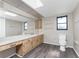 Bathroom with wood vanity and flooring at 684 Corrientes Cir, Punta Gorda, FL 33983