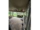 Covered patio with stone outdoor kitchen and open yard view at 15222 Lost Lake Ln, Lithia, FL 33547