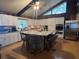 Modern kitchen with white cabinets, granite island, and stainless steel appliances at 15222 Lost Lake Ln, Lithia, FL 33547