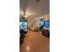 Living room with light beige couch and access to a screened porch at 15222 Lost Lake Ln, Lithia, FL 33547