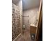 Bathroom with shower, grab bars, and tiled floor at 15222 Lost Lake Ln, Lithia, FL 33547
