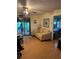 Living room with light beige couch and access to a screened porch at 15222 Lost Lake Ln, Lithia, FL 33547