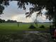 View of wide open farmland beyond the property line at 15222 Lost Lake Ln, Lithia, FL 33547