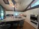 Modern kitchen with white cabinets, granite island, and stainless steel appliances at 15222 Lost Lake Ln, Lithia, FL 33547