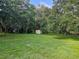 Large backyard with shed and mature trees at 15222 Lost Lake Ln, Lithia, FL 33547