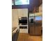 Stainless steel appliances and white kitchen cabinetry at 15222 Lost Lake Ln, Lithia, FL 33547